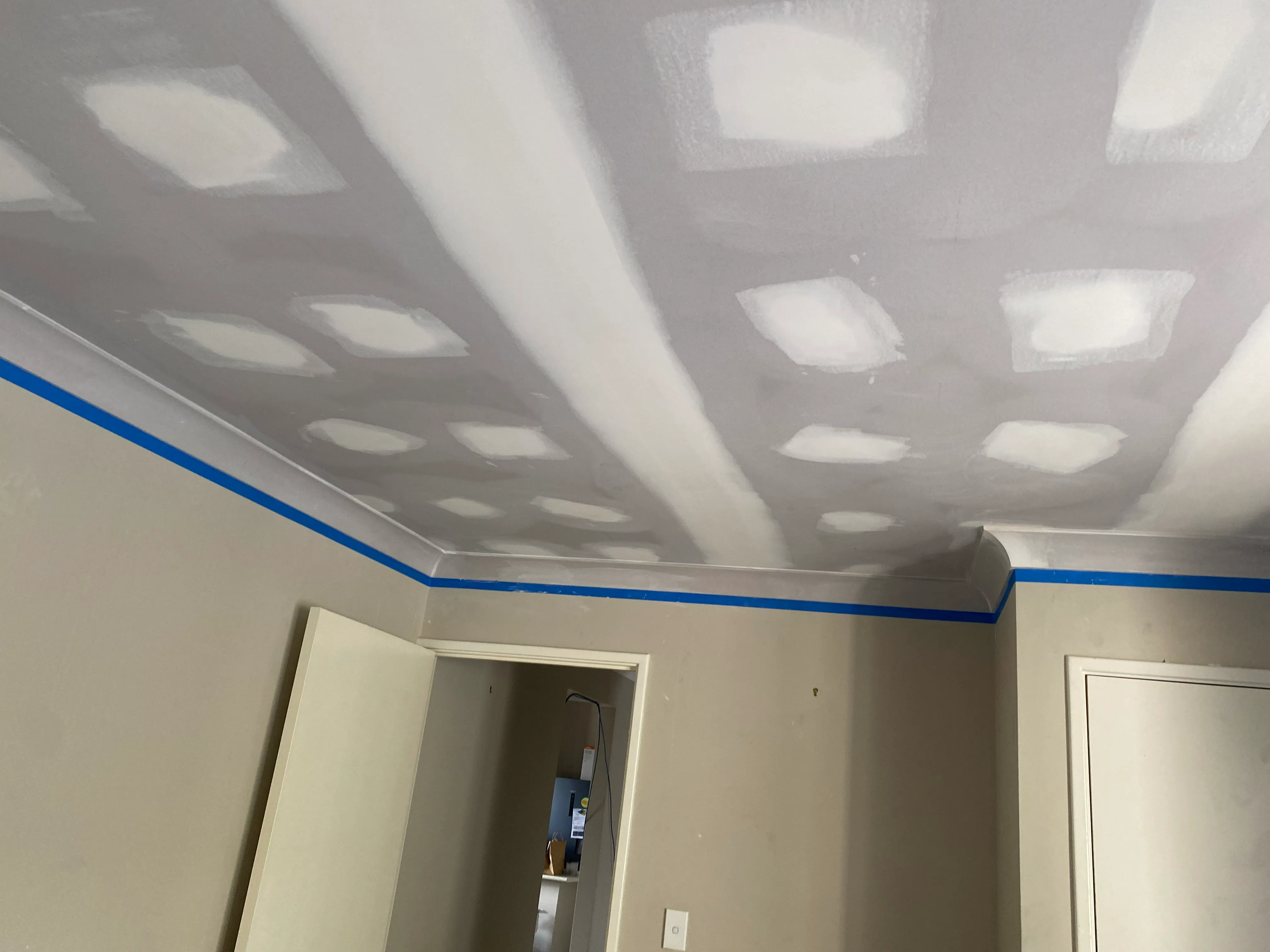 Professional sagging ceiling repair work in progress
