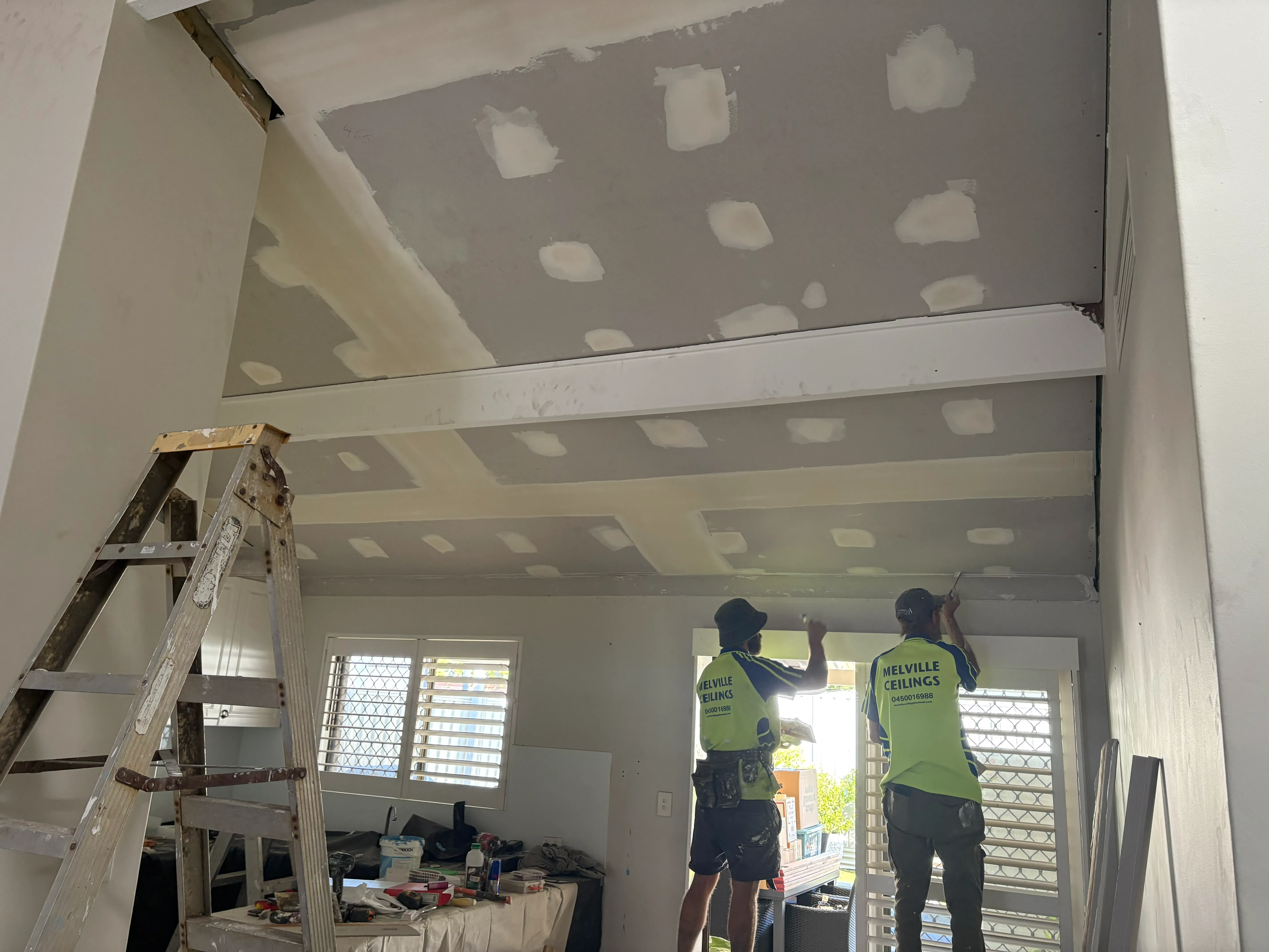 Melville Ceilings team repairing sagging ceiling